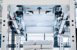 Stretch hood machines